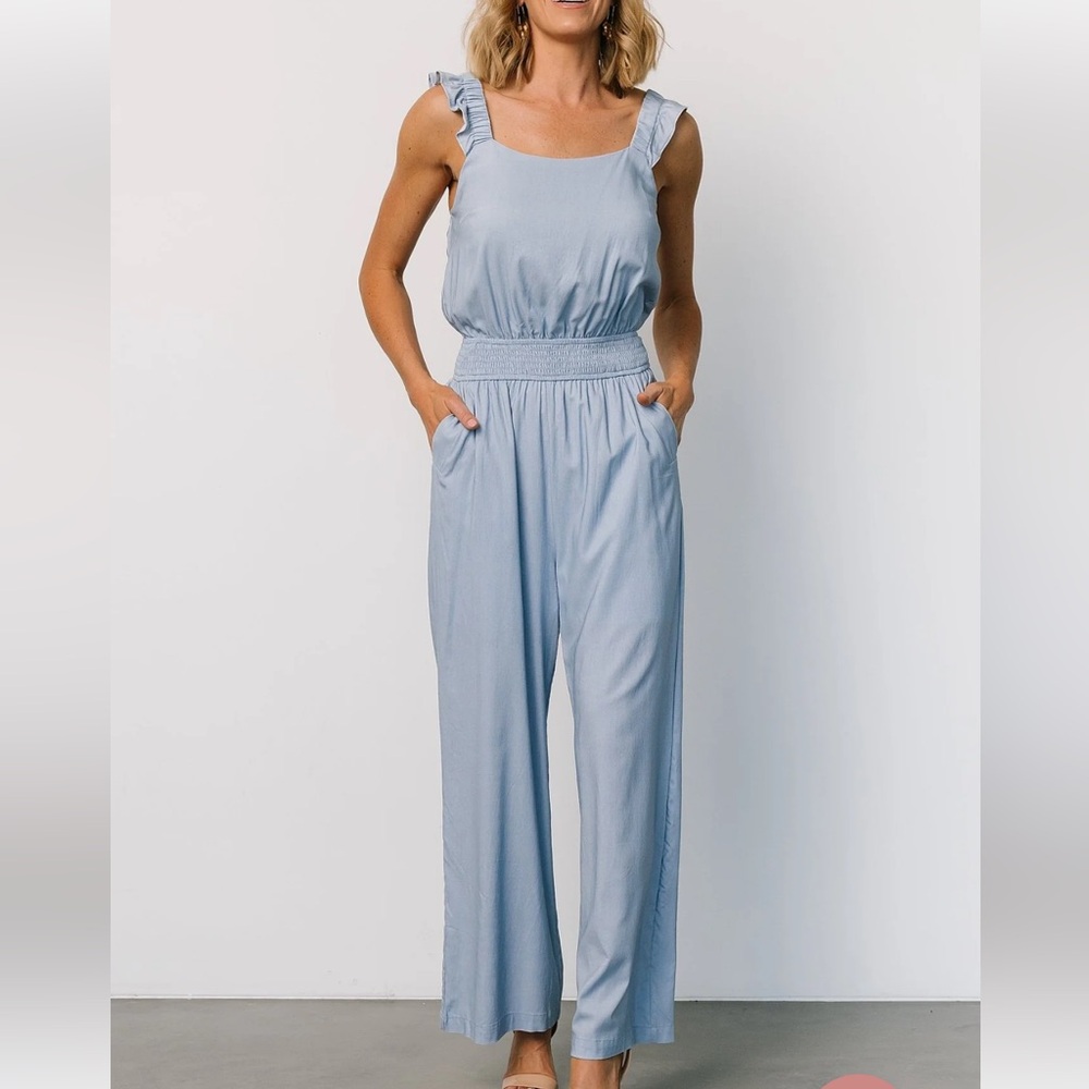 Denim light blue jumpsuit, brand new with tag, size small.